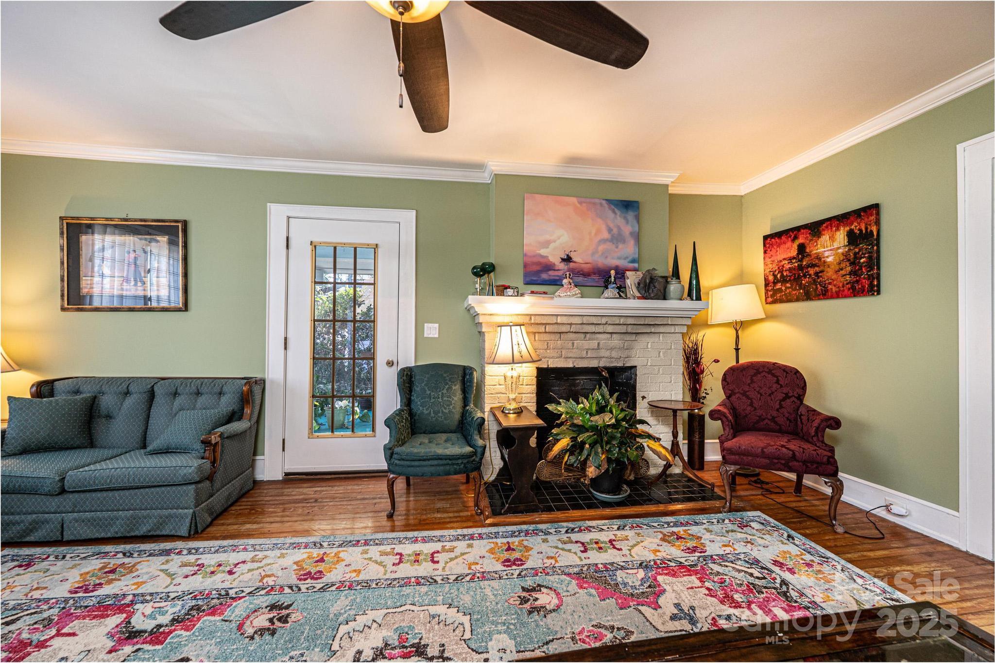 221 3rd Street Northeast Hickory, NC 28601 - Photo 10 of 40 a living room with furniture and a fireplace