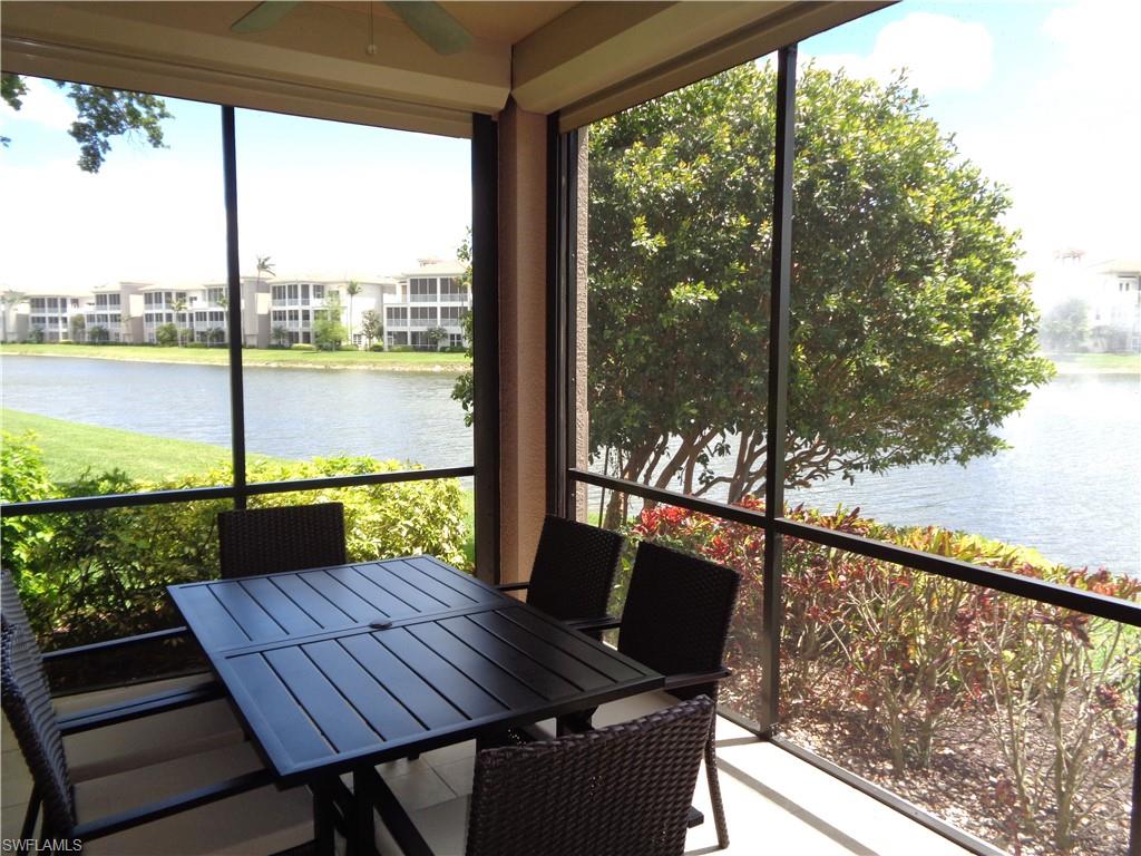 734 Regency Reserve Circle, Unit 2701 Naples, FL 34119 - Photo 29 of 37 a view of a balcony with lake view and a couches