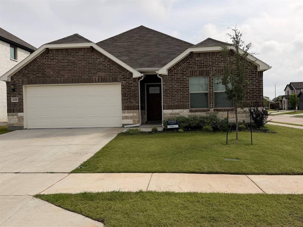 6400 Texas Ranger Trail Fort Worth, TX 76123 - Photo 1 of 14 a front view of a house with a garden