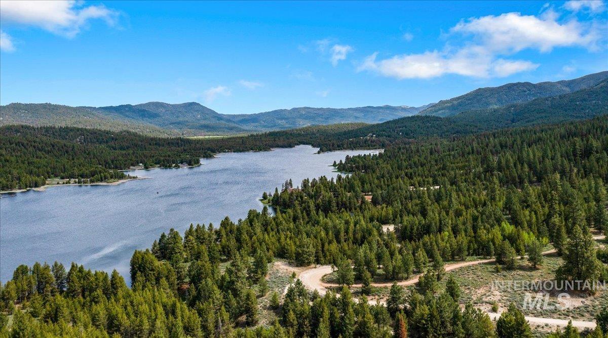 Tbd Pointes Road Cascade, ID 83611 - Photo 2 of 50 View of mountain background featuring a heavily wooded area and a large body of water