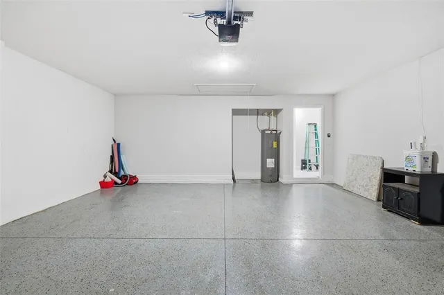 a view of empty room with air conditioner and window