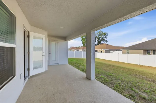 a view of a big room with an outdoor space and seating