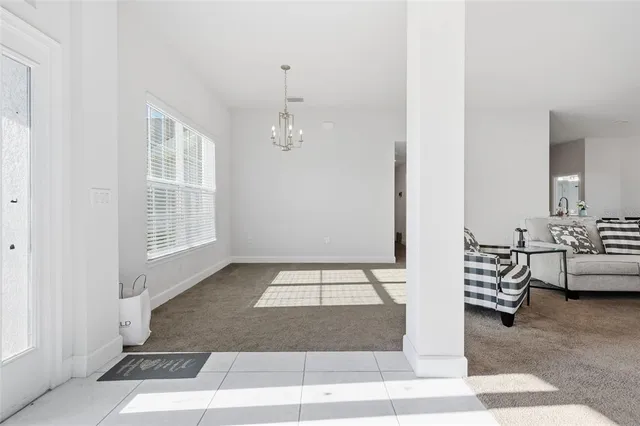 a view of living room with furniture and window