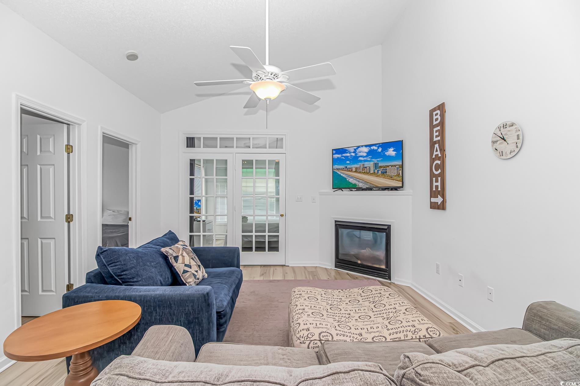 9754 Leyland Drive, Unit 9 Myrtle Beach, SC 29572 - Photo 13 of 40 Living area featuring lofted ceiling, a glass cove