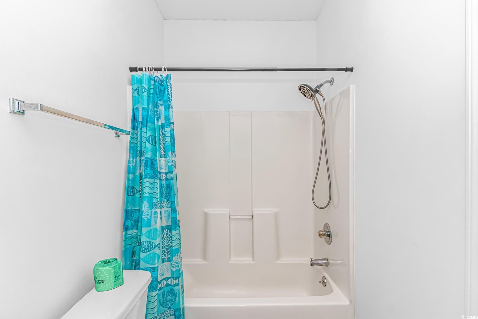 9754 Leyland Drive, Unit 9 Myrtle Beach, SC 29572 - Photo 18 of 40 Bathroom featuring shower / bath combo and toilet