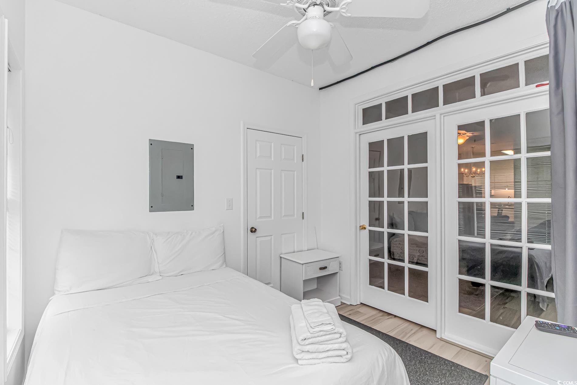 9754 Leyland Drive, Unit 9 Myrtle Beach, SC 29572 - Photo 20 of 40 Bedroom with electric panel, wood finished floors,