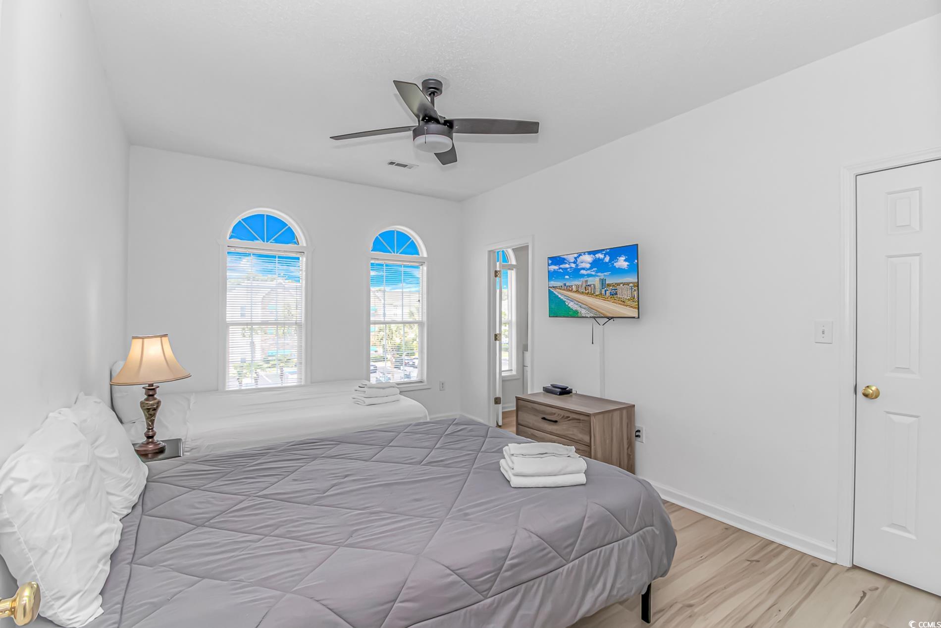 9754 Leyland Drive, Unit 9 Myrtle Beach, SC 29572 - Photo 21 of 40 Bedroom with light wood finished floors and a ceil