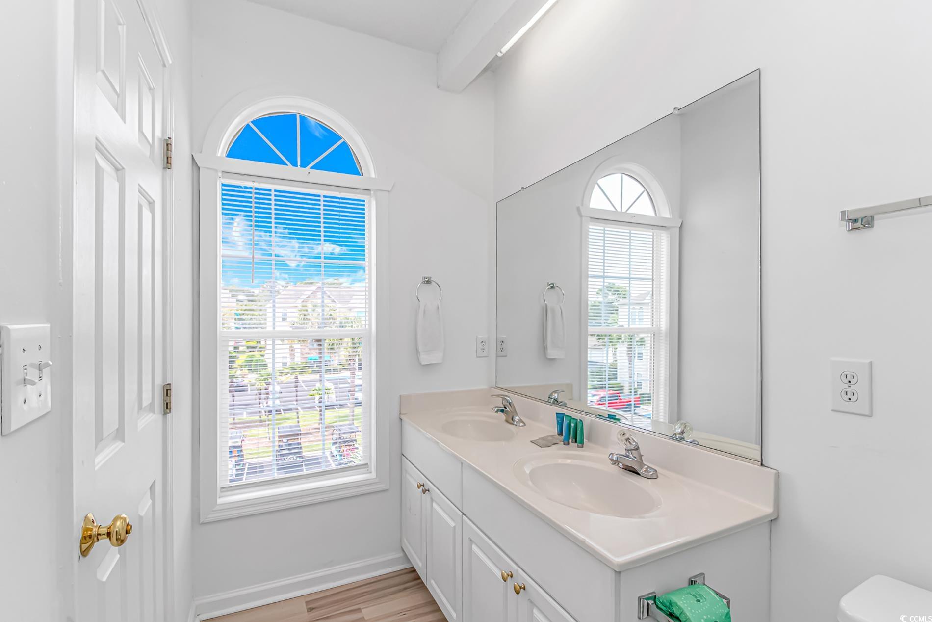 9754 Leyland Drive, Unit 9 Myrtle Beach, SC 29572 - Photo 23 of 40 Bathroom featuring double vanity and wood finished