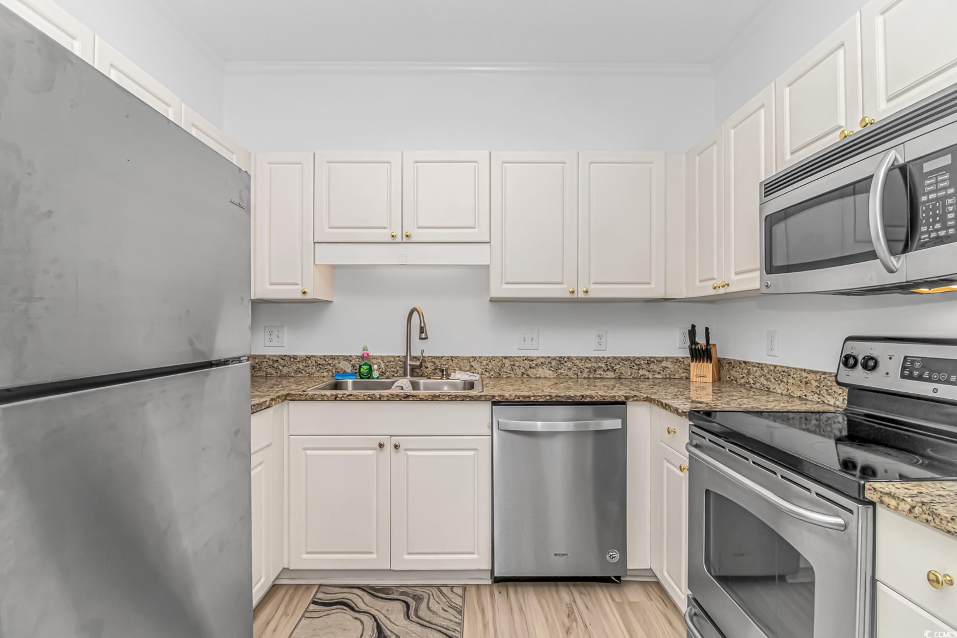 9754 Leyland Drive, Unit 9 Myrtle Beach, SC 29572 - Photo 7 of 40 Kitchen with appliances with stainless steel finis