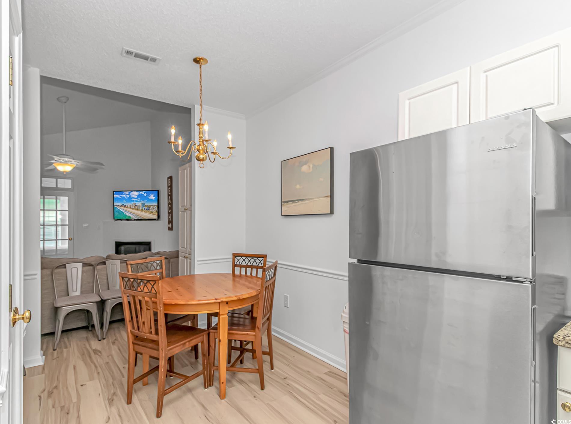 9754 Leyland Drive, Unit 9 Myrtle Beach, SC 29572 - Photo 9 of 40 Dining area featuring light wood-style floors, a c