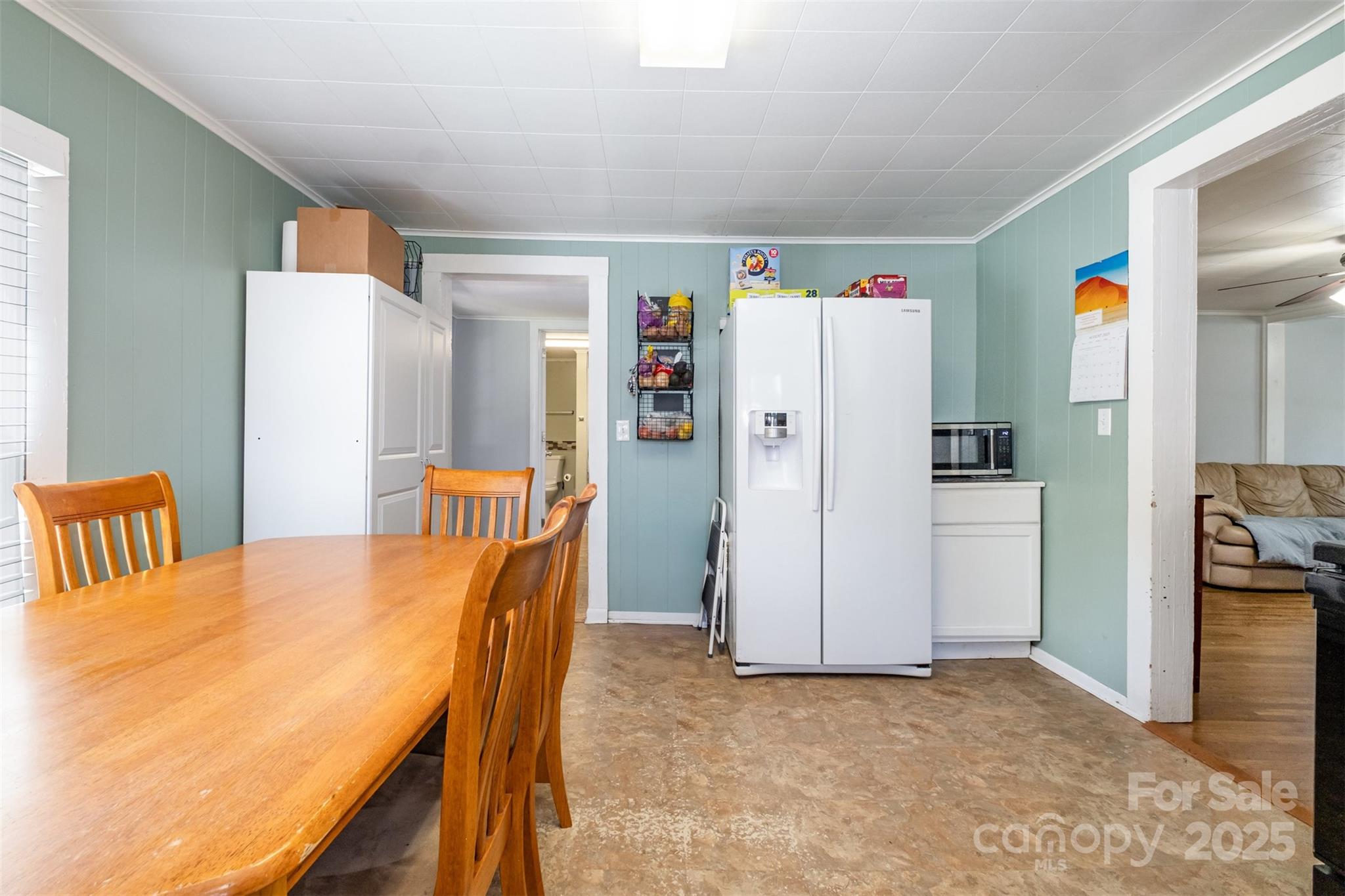 811 Cleveland Avenue Grover, NC 28073 - Photo 13 of 43 a bedroom with a bed and a refrigerator