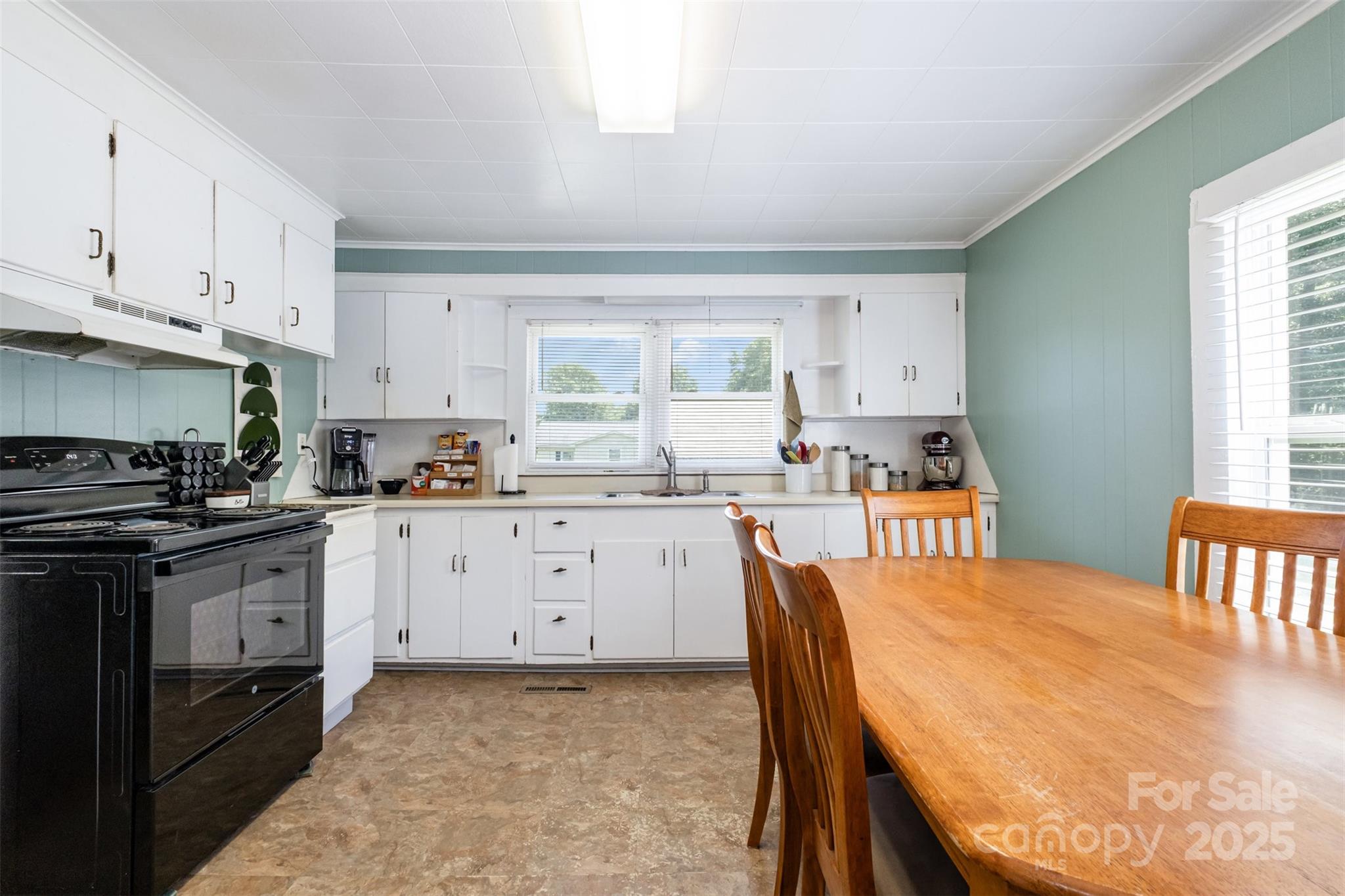 811 Cleveland Avenue Grover, NC 28073 - Photo 15 of 43 a kitchen with stainless steel appliances granite countertop a stove a sink dishwasher and cabinets