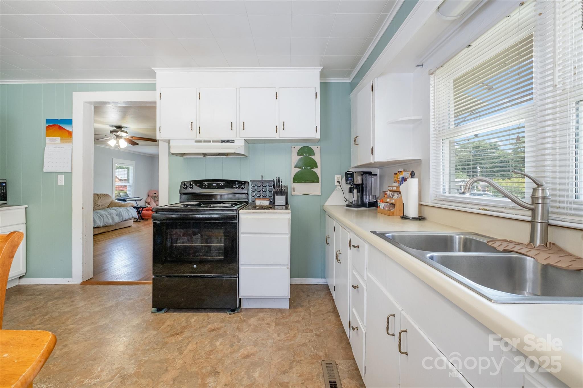 811 Cleveland Avenue Grover, NC 28073 - Photo 17 of 43 a kitchen with granite countertop a sink cabinets and stainless steel appliances