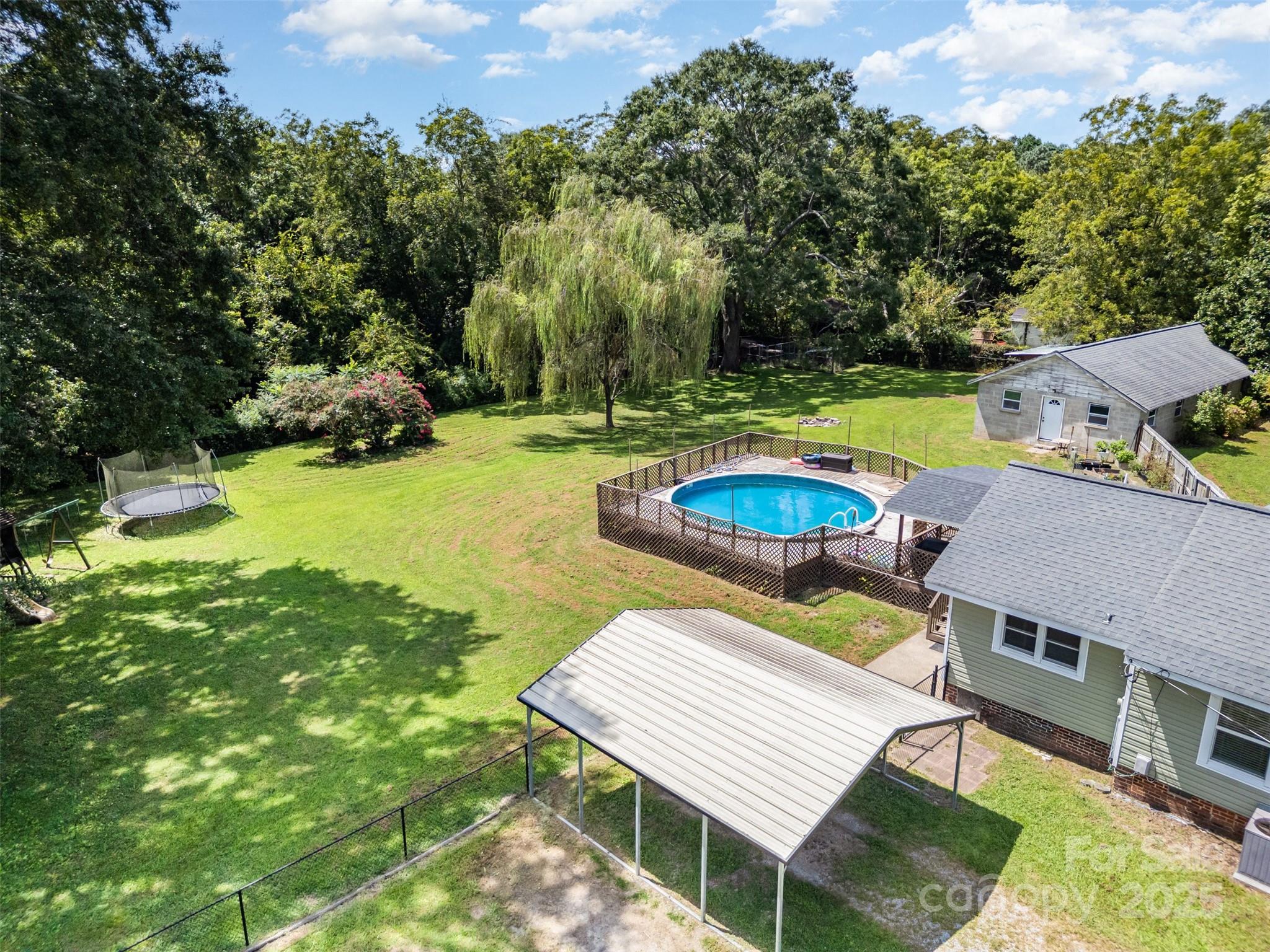 811 Cleveland Avenue Grover, NC 28073 - Photo 2 of 43 an aerial view of a house with swimming pool and a yard