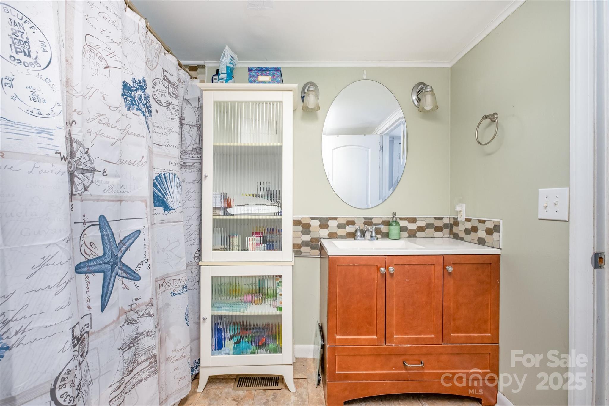 811 Cleveland Avenue Grover, NC 28073 - Photo 26 of 43 a bathroom with a mirror and a sink