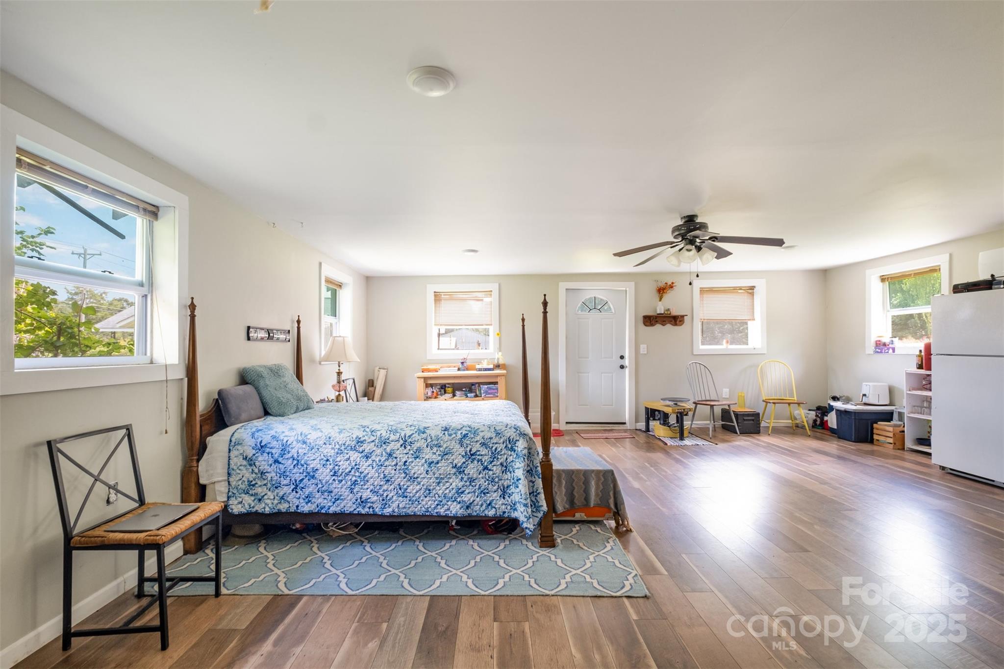 811 Cleveland Avenue Grover, NC 28073 - Photo 34 of 43 a bedroom with a bed and wooden floor