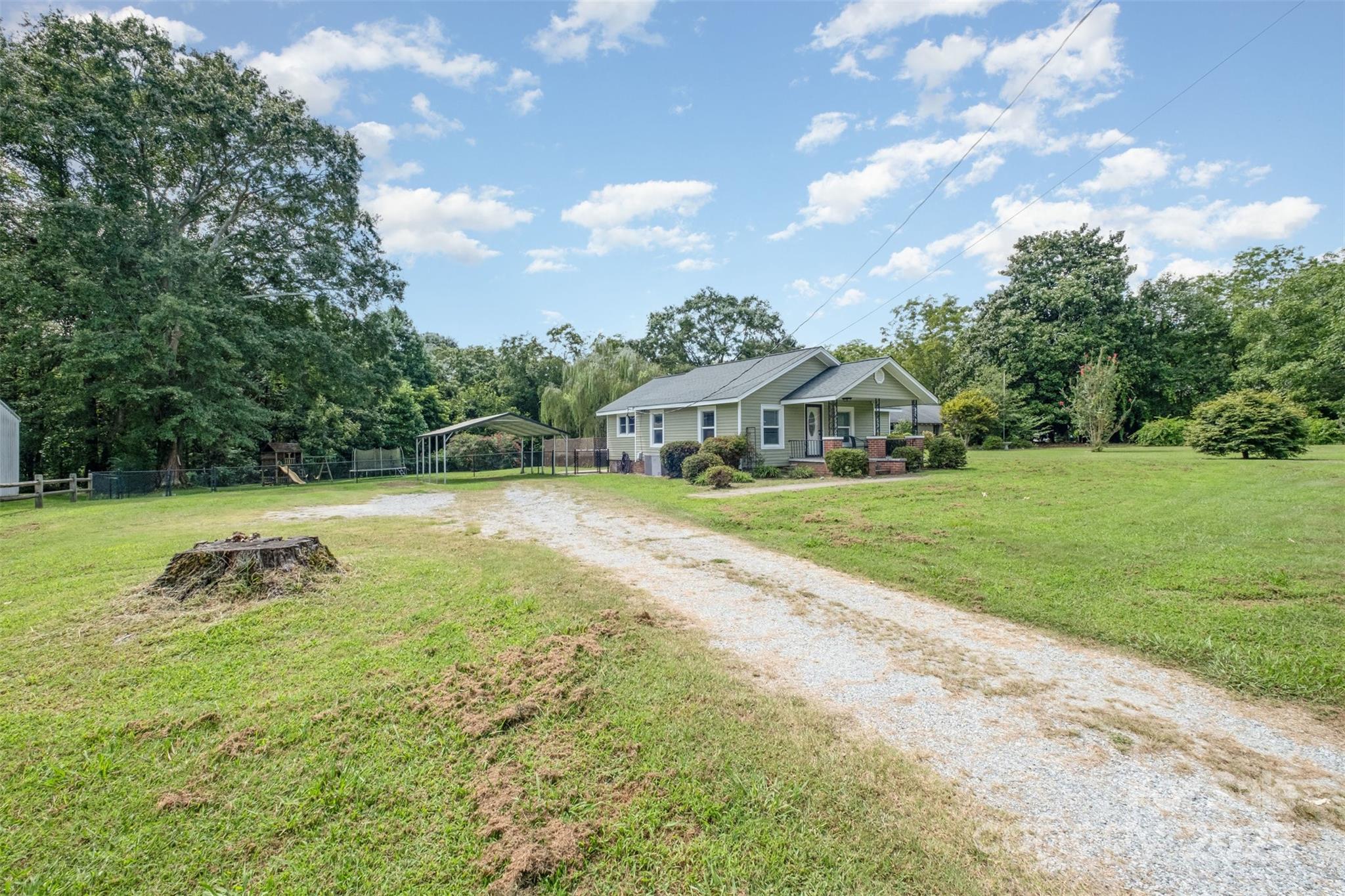 811 Cleveland Avenue Grover, NC 28073 - Photo 4 of 43 a view of a house with a yard