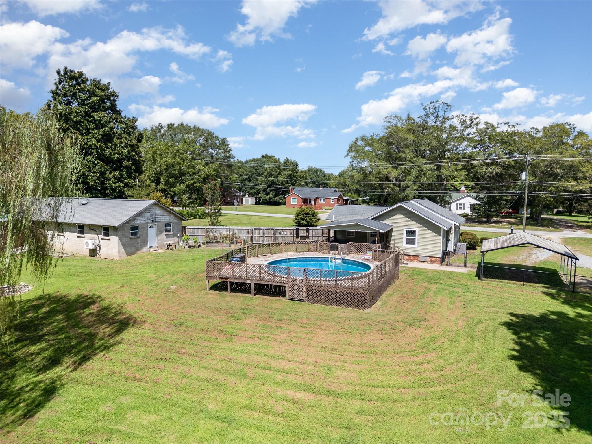 811 Cleveland Avenue Grover, NC 28073 - Photo 43 of 43 an aerial view of a house with swimming pool and green space