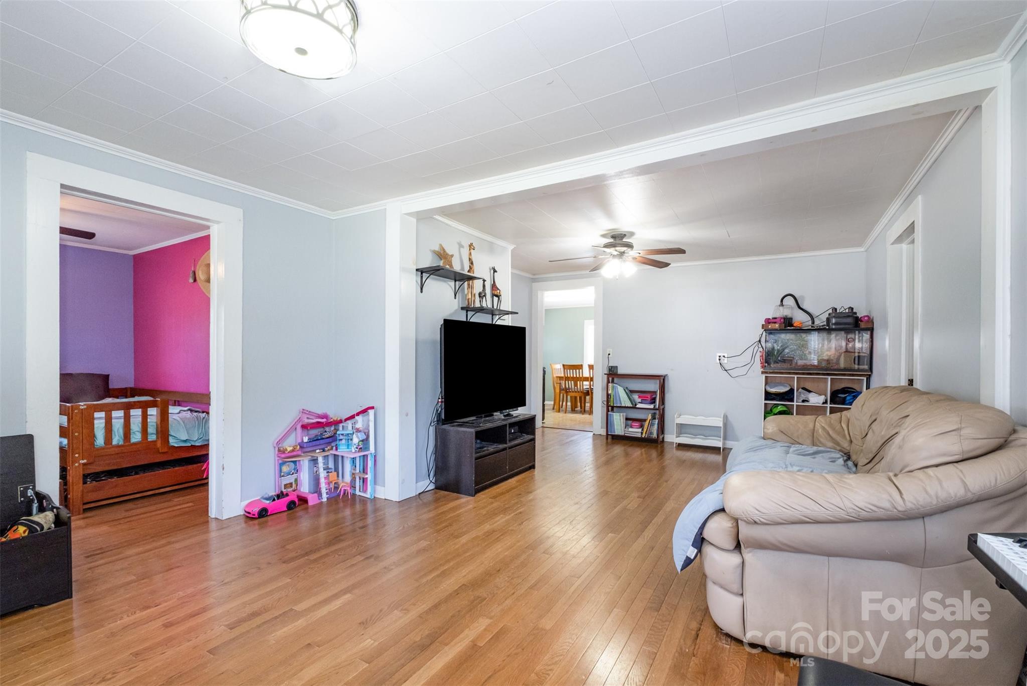 811 Cleveland Avenue Grover, NC 28073 - Photo 10 of 43 a living room with furniture and a flat screen tv