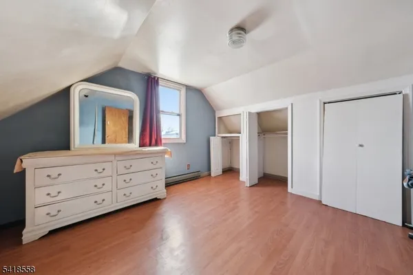 a view of room with window and cabinet