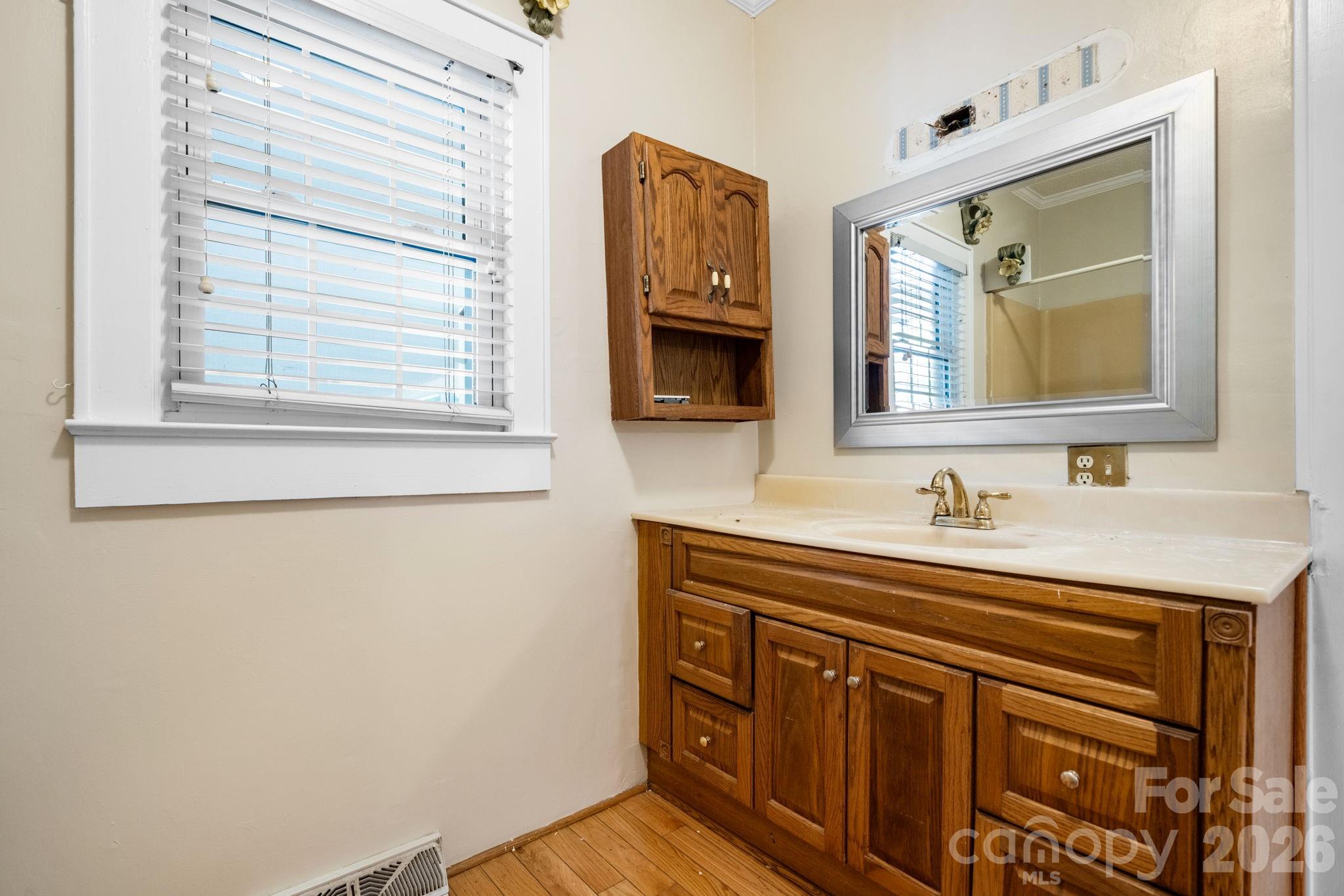 144 Hunter Bridge Road Stony Point, NC 28678 - Photo 20 of 45 a bathroom with a sink vanity and mirror