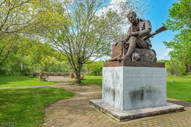 a view of a garden with a lake view