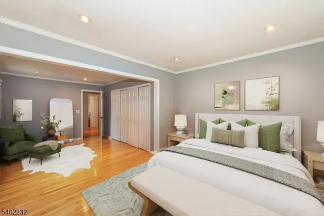 a bedroom with a large bed and a couch