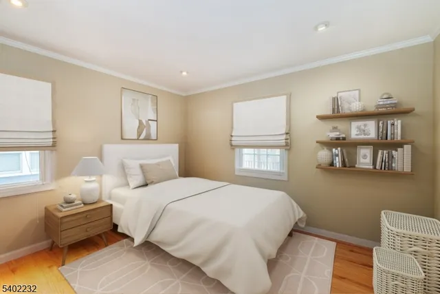 a bedroom with bed and window