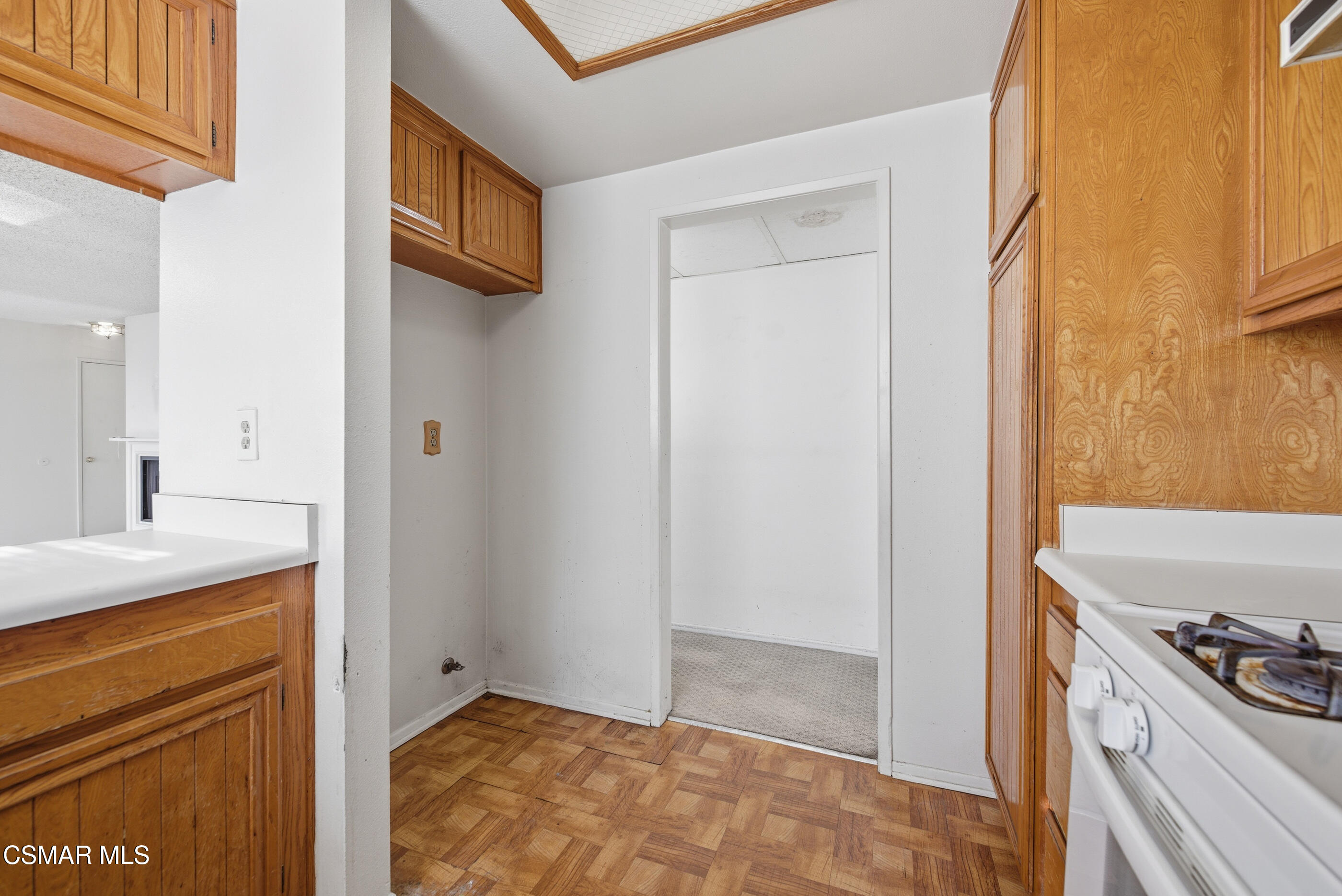 20342 Rue Crevier, Unit 613 Canyon Country, CA 91351 - Photo 13 of 36 a view of a kitchen cabinets and a wooden floor