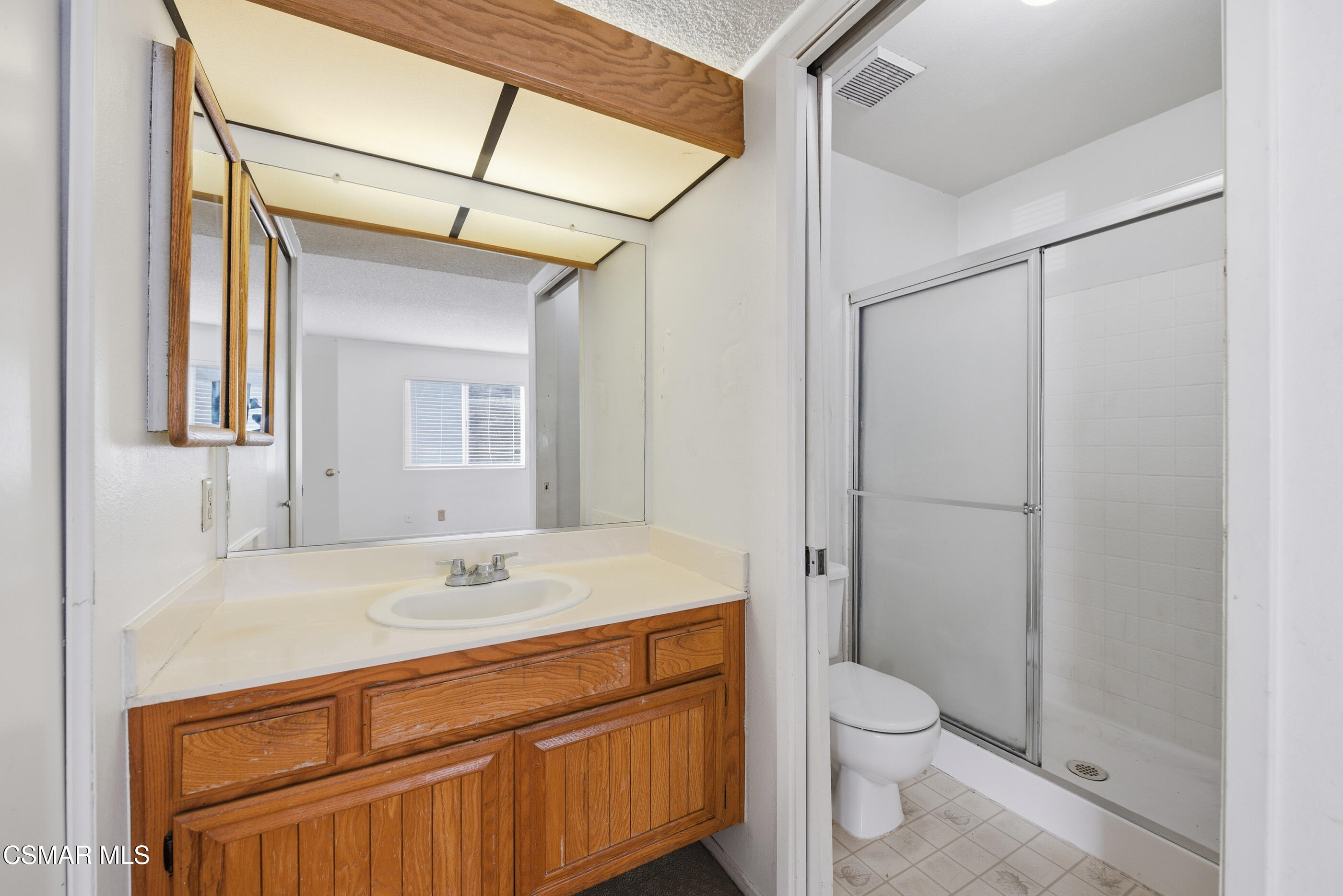 20342 Rue Crevier, Unit 613 Canyon Country, CA 91351 - Photo 18 of 36 a bathroom with a sink a toilet and shower