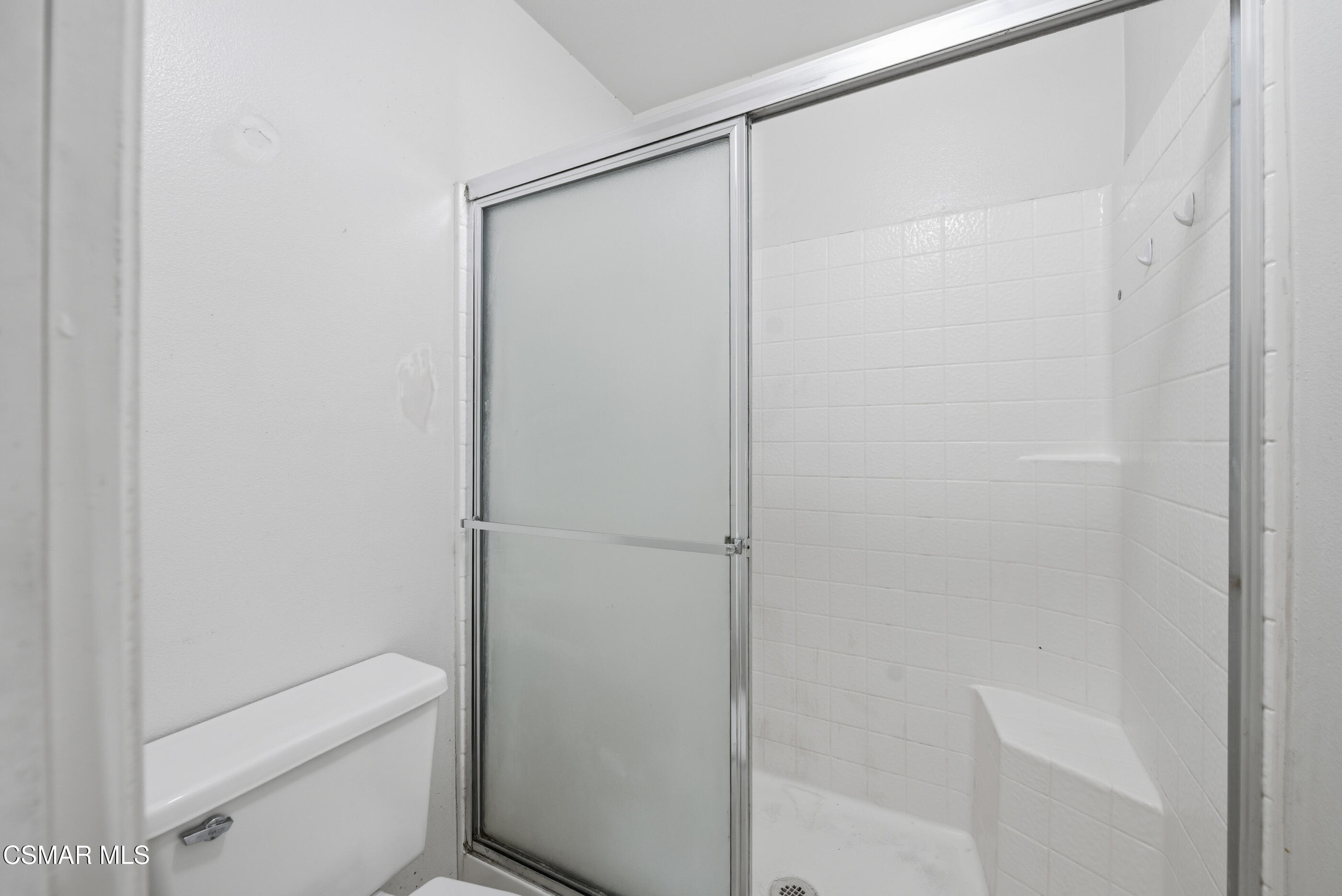 20342 Rue Crevier, Unit 613 Canyon Country, CA 91351 - Photo 19 of 36 a bathroom with a shower a toilet and a sink