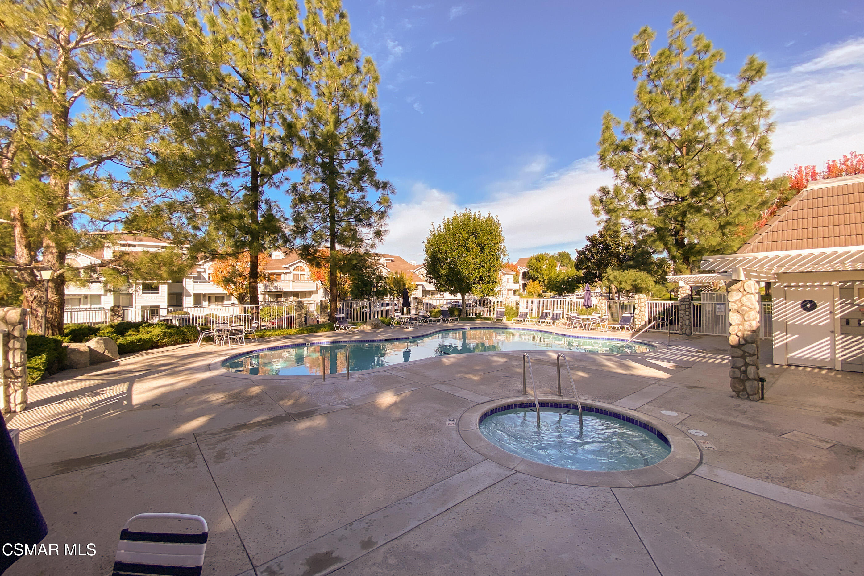 20342 Rue Crevier, Unit 613 Canyon Country, CA 91351 - Photo 36 of 36 a view of a swimming pool with an outdoor seating
