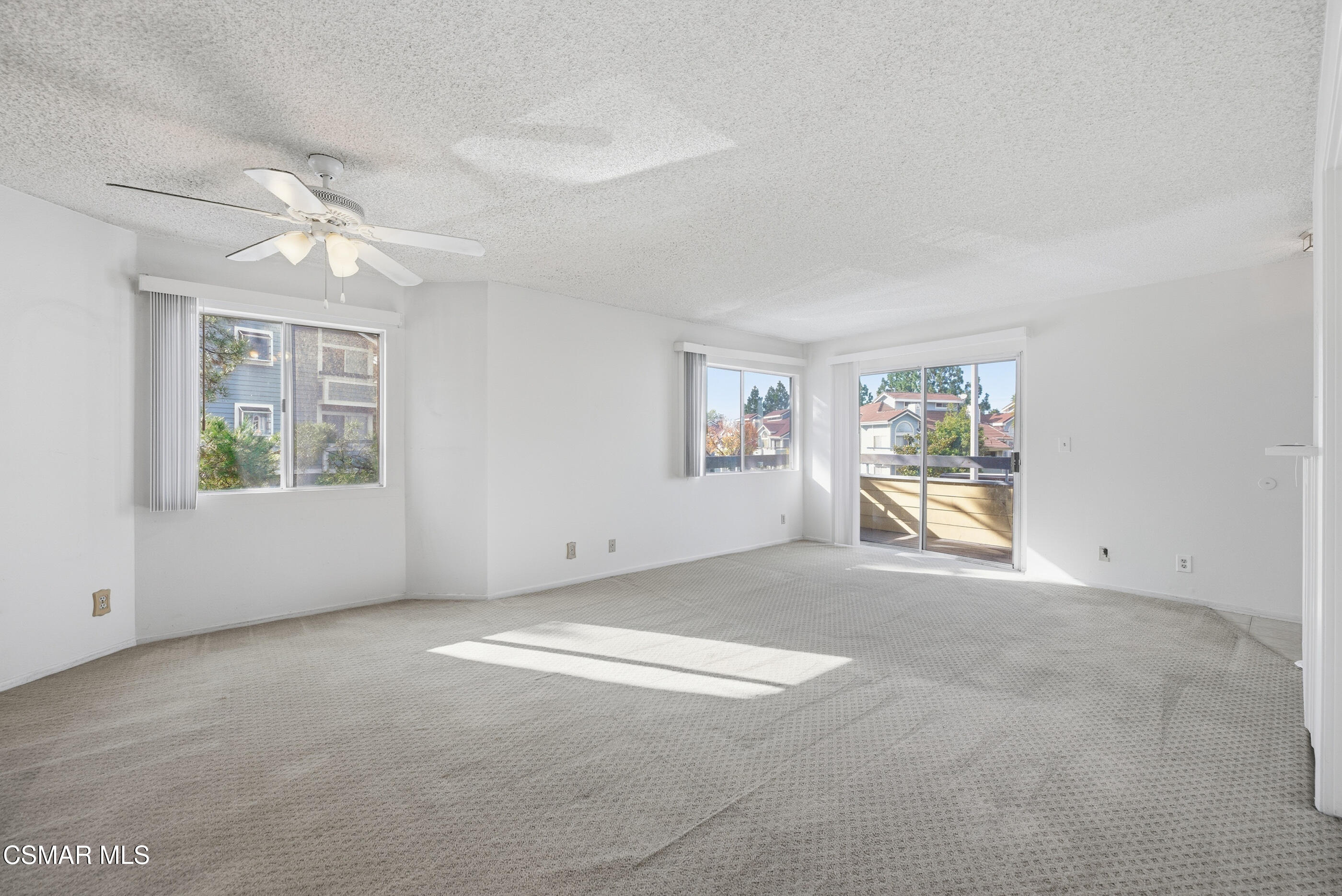 20342 Rue Crevier, Unit 613 Canyon Country, CA 91351 - Photo 9 of 36 an empty room with windows and ceiling fan