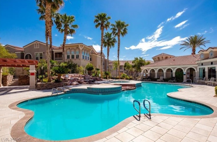 10550 West Alexander Road, Unit 2177 Las Vegas, NV 89129 - Photo 19 of 19 This outdoor pool area offers a refreshing oasis with ample space for leisure and relaxation.
