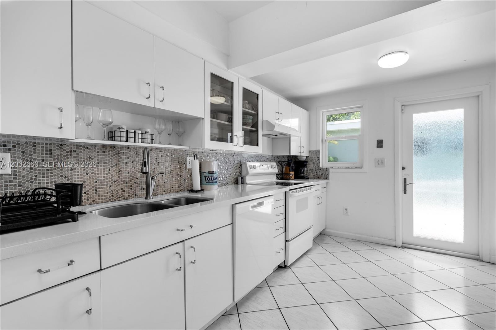520 Southwest 22nd Road Miami, FL 33129 - Photo 41 of 76 a kitchen with a sink and cabinets