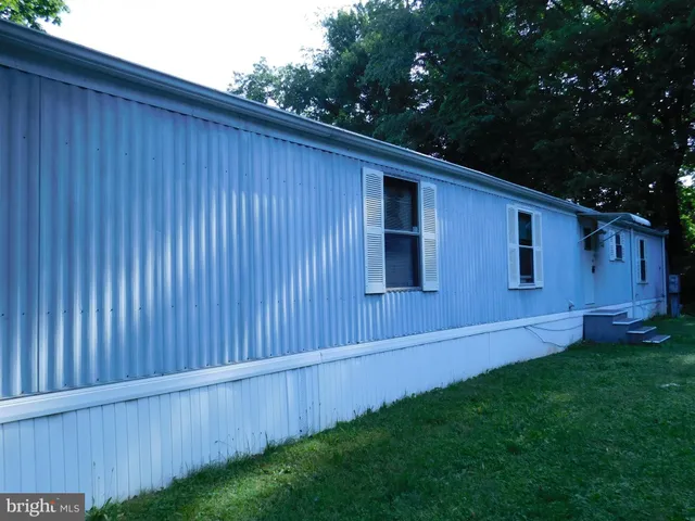 a view of backyard with hardwood and deck