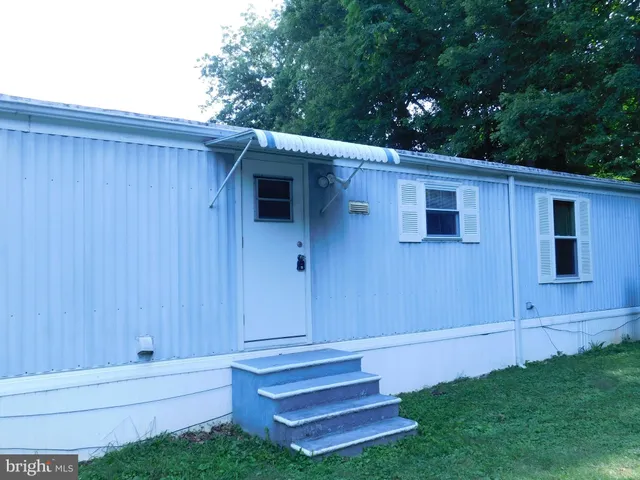 a view of backyard with cabin