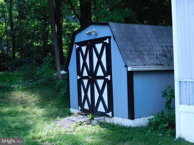 a wooden door in front of a house