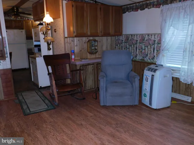 a view of kitchen with furniture and a window