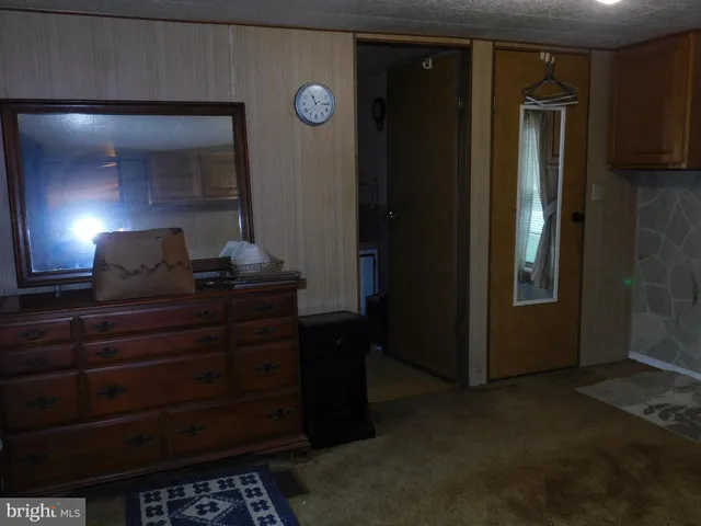 a room with a closet and a lamp