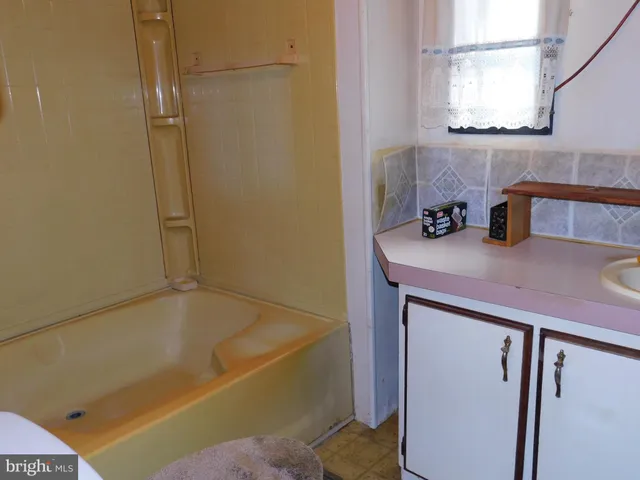 a bathroom with a sink and a bathtub