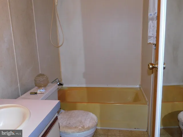 a bathroom with a sink and toilet