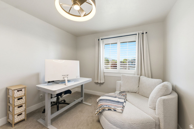 1405 Vintry Lane Murray, UT 84121 - Photo 21 of 44 Room featuring a window with plantation shutters, light gray walls, and carpet flooring