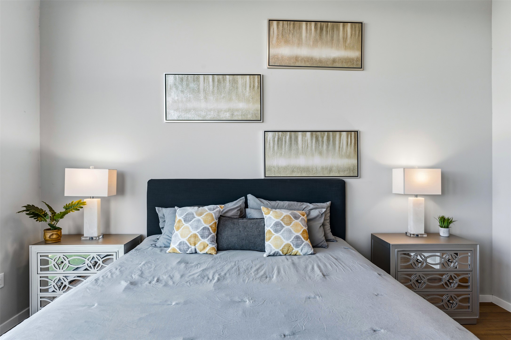 5921 Hiline Road, Unit 2304 Austin, TX 78734 - Photo 19 of 38 a bed room with a bed and a lamp