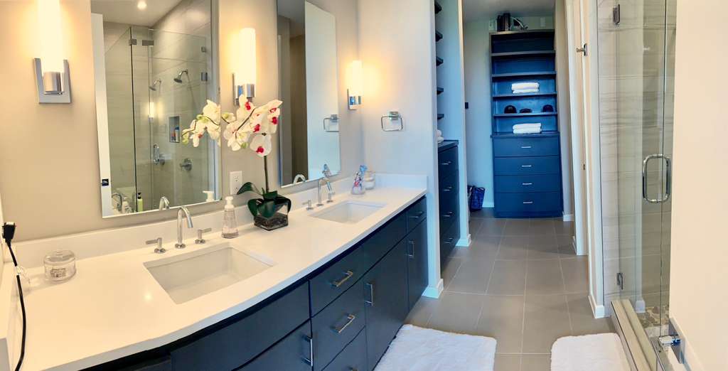 5921 Hiline Road, Unit 2304 Austin, TX 78734 - Photo 25 of 38 Full bathroom with double vanity, a shower stall, and dark tile patterned floors