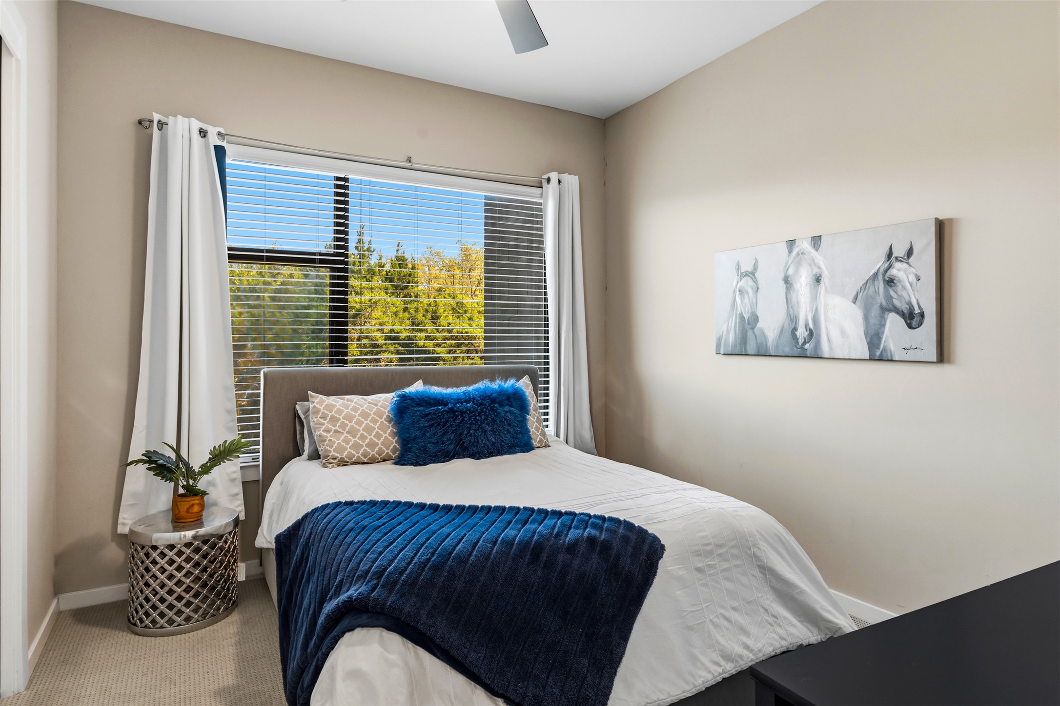 5921 Hiline Road, Unit 2304 Austin, TX 78734 - Photo 5 of 38 a bedroom with a large bed and a window