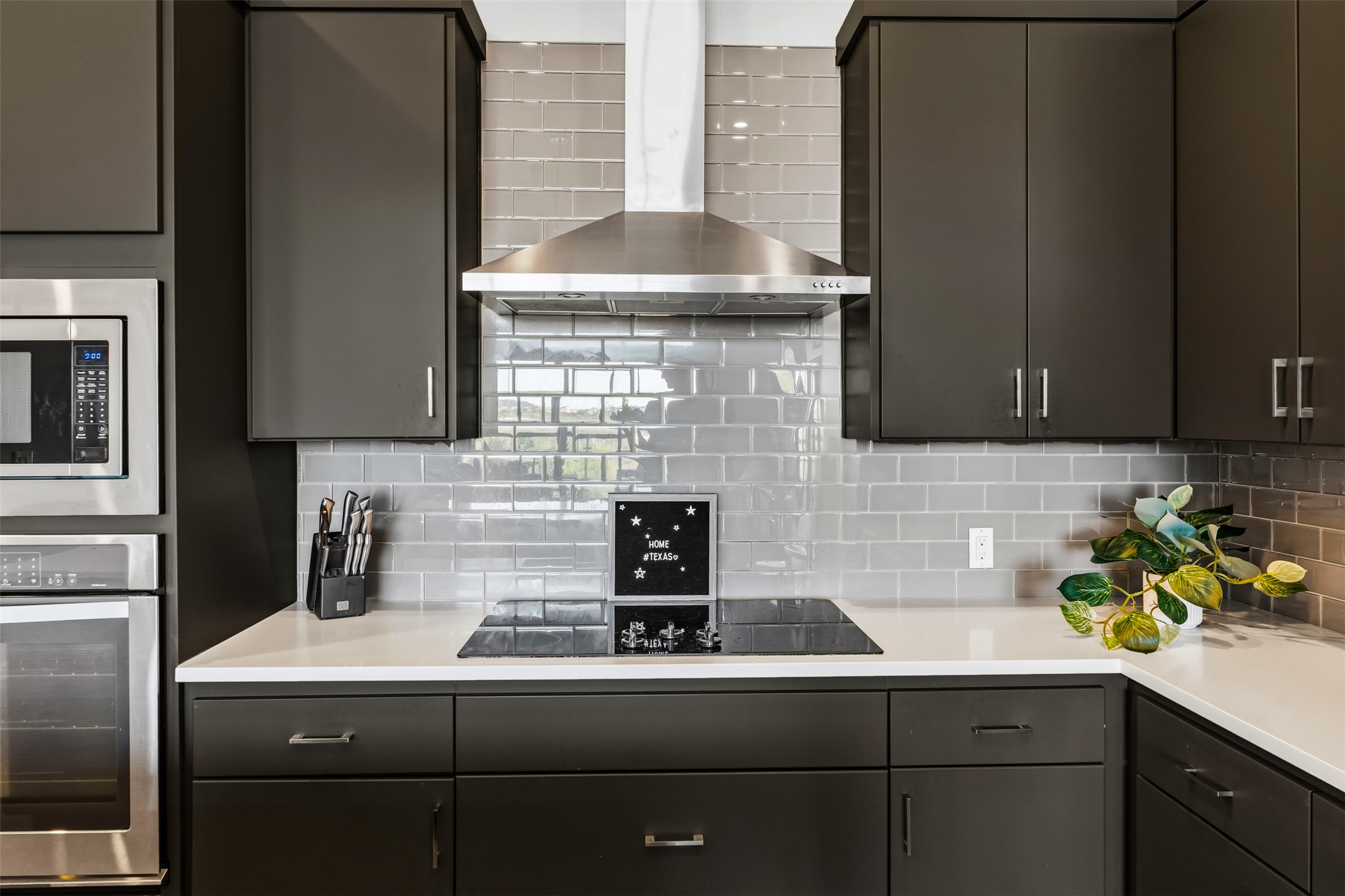 5921 Hiline Road, Unit 2304 Austin, TX 78734 - Photo 9 of 38 a kitchen with a sink and cabinets