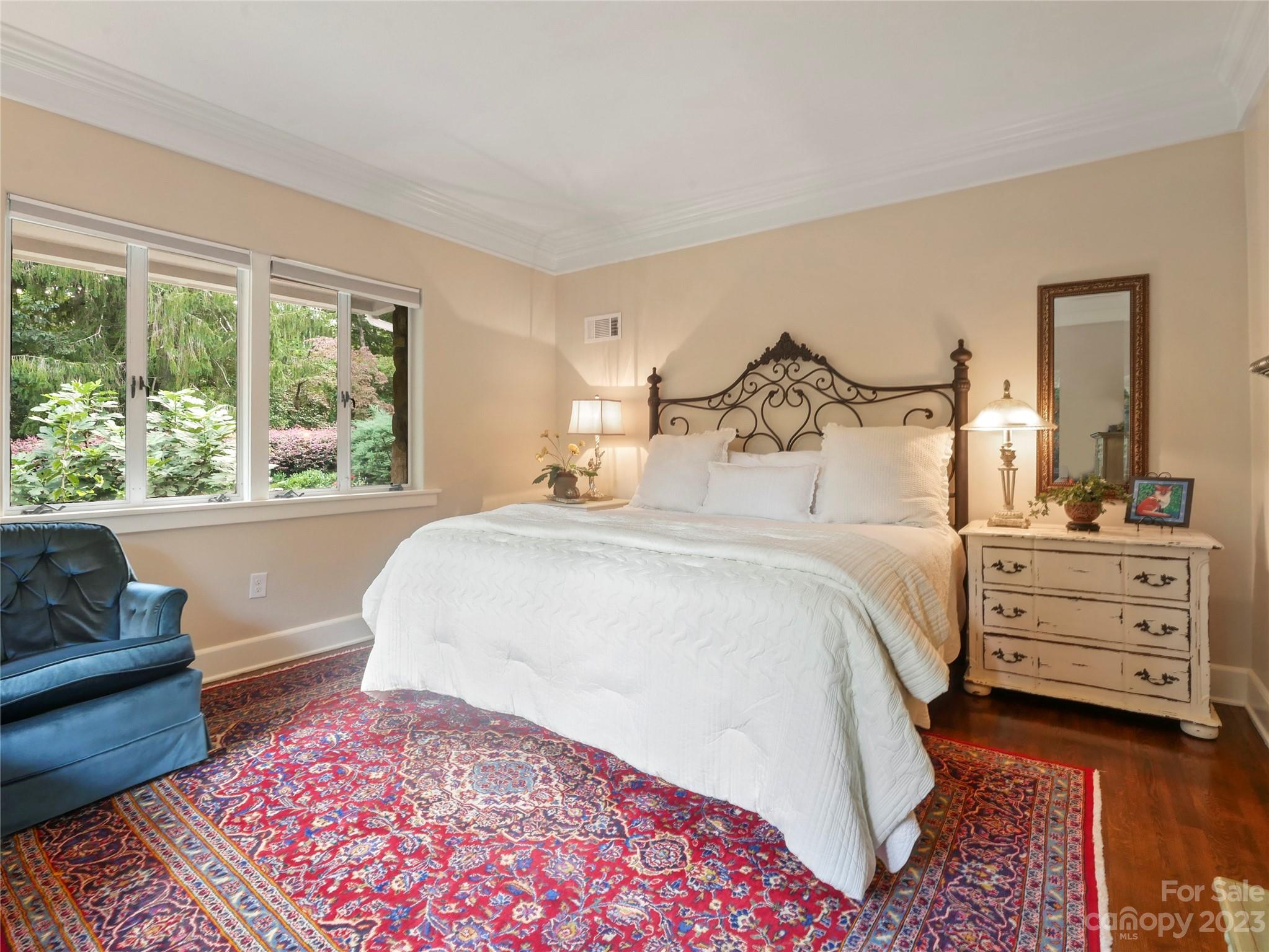 250 Sourwood Ridge Road Tryon, NC 28782 - Photo 12 of 43 a bedroom with a large bed and a dresser