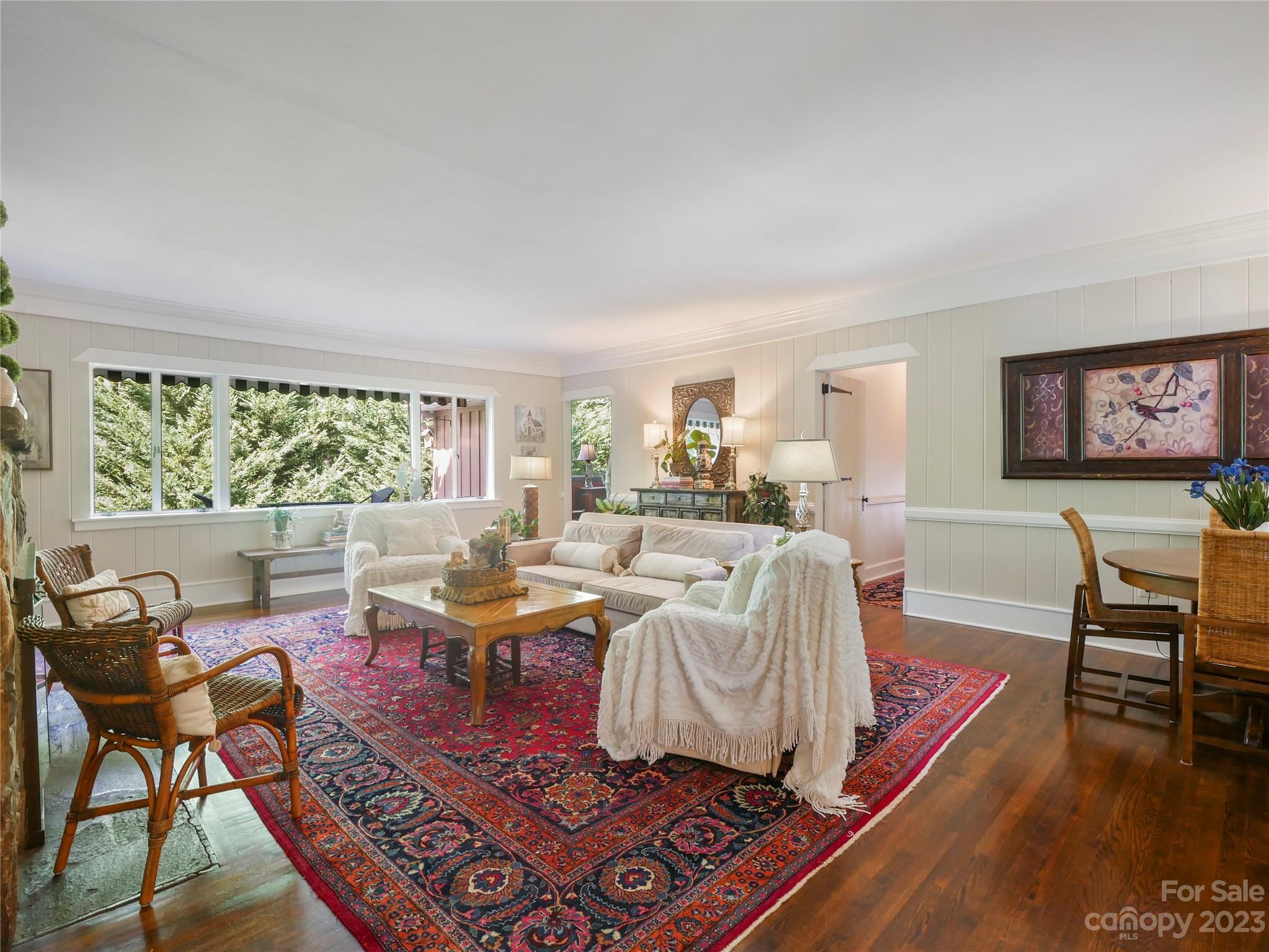 250 Sourwood Ridge Road Tryon, NC 28782 - Photo 21 of 43 a living room with furniture and a wooden floor