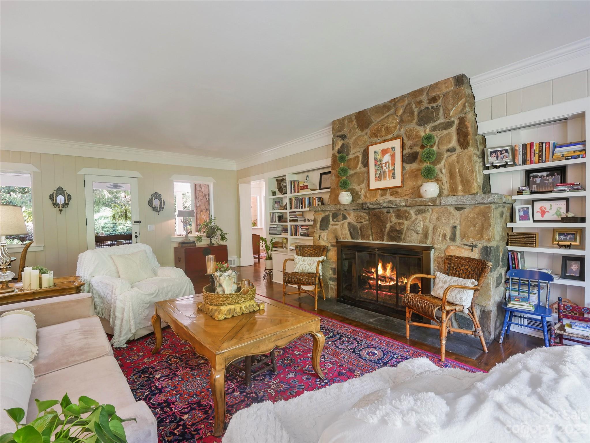 250 Sourwood Ridge Road Tryon, NC 28782 - Photo 6 of 43 a living room with furniture a rug and a fireplace